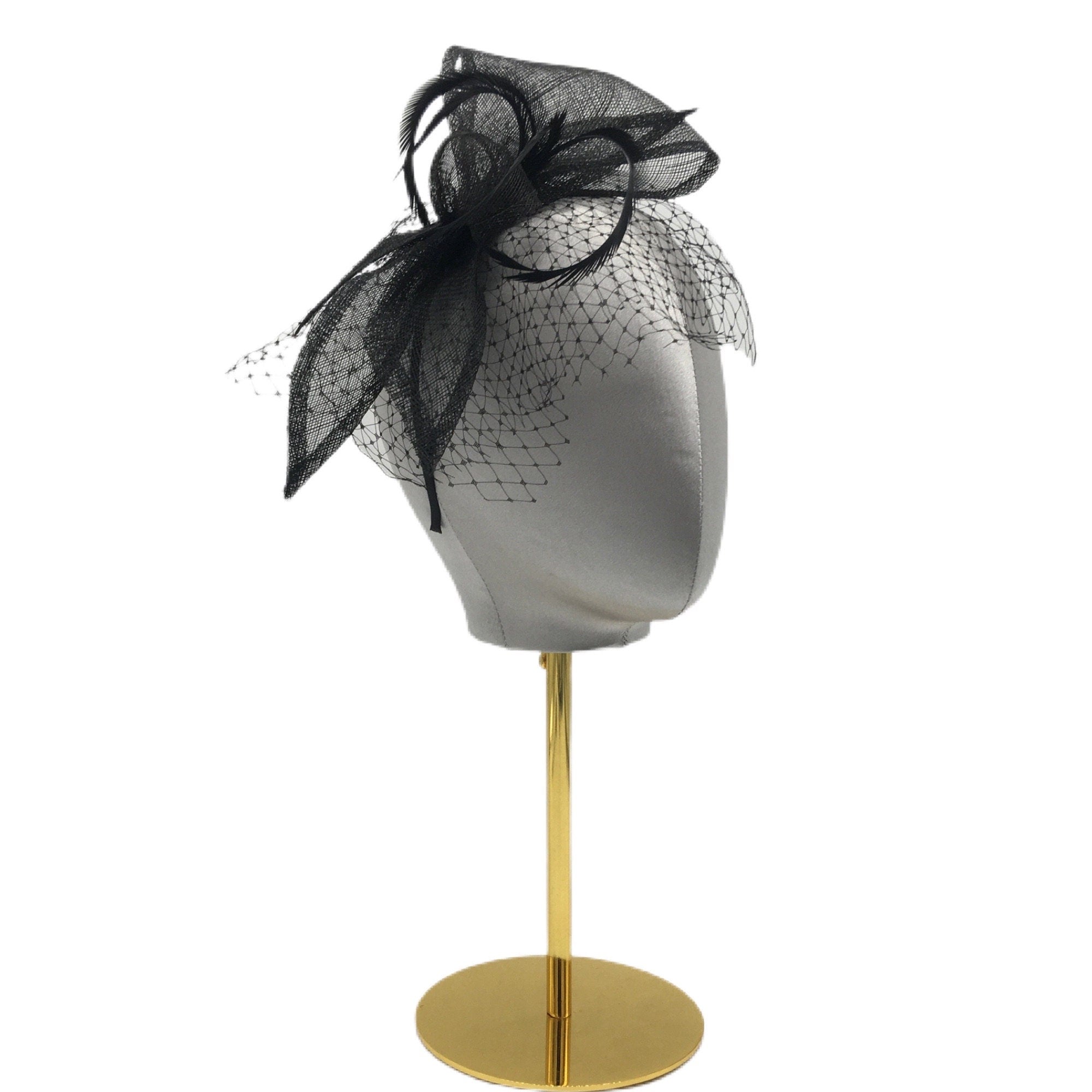 Black fascinator with a black feather accent