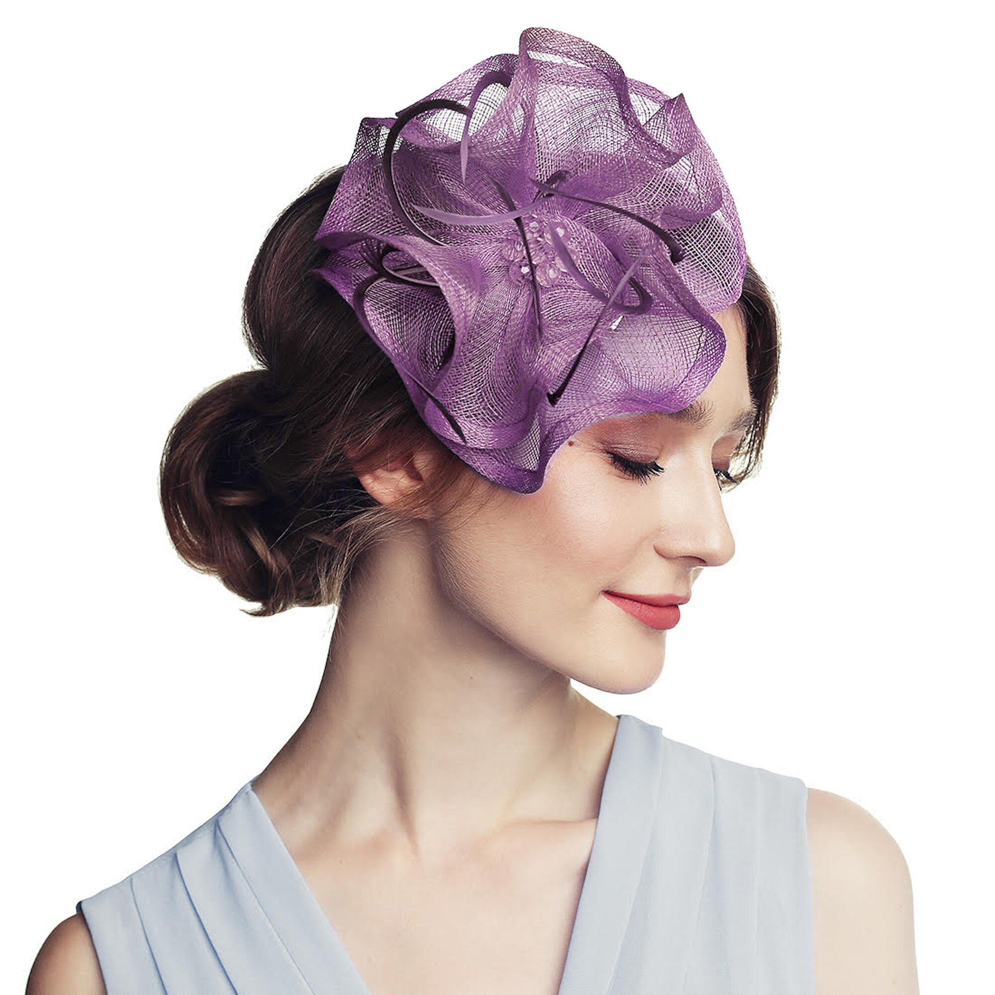 A headpiece with a floral design. The headpiece is made of a mesh material and is worn on the side of the head.