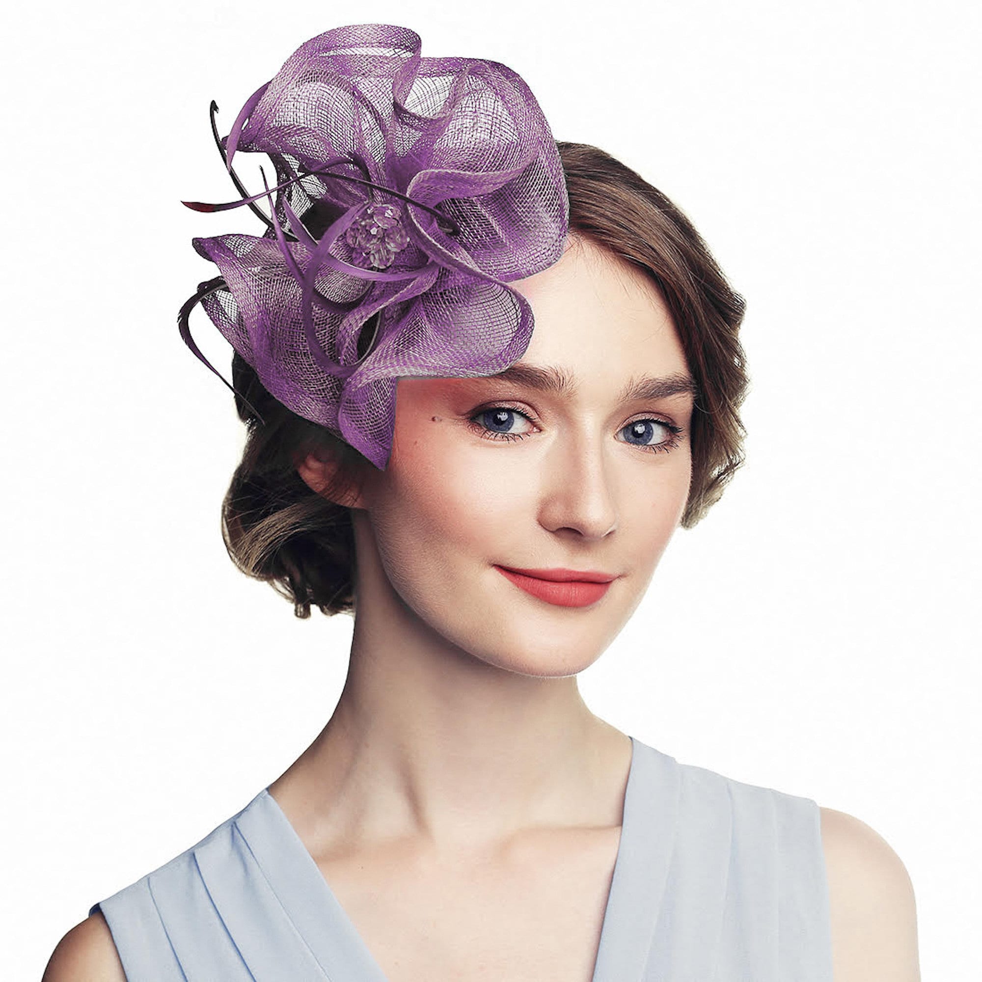 Lavender fascinator with a layered, flower-like design. The headpiece features a central cluster of decorative elements and dark accents.