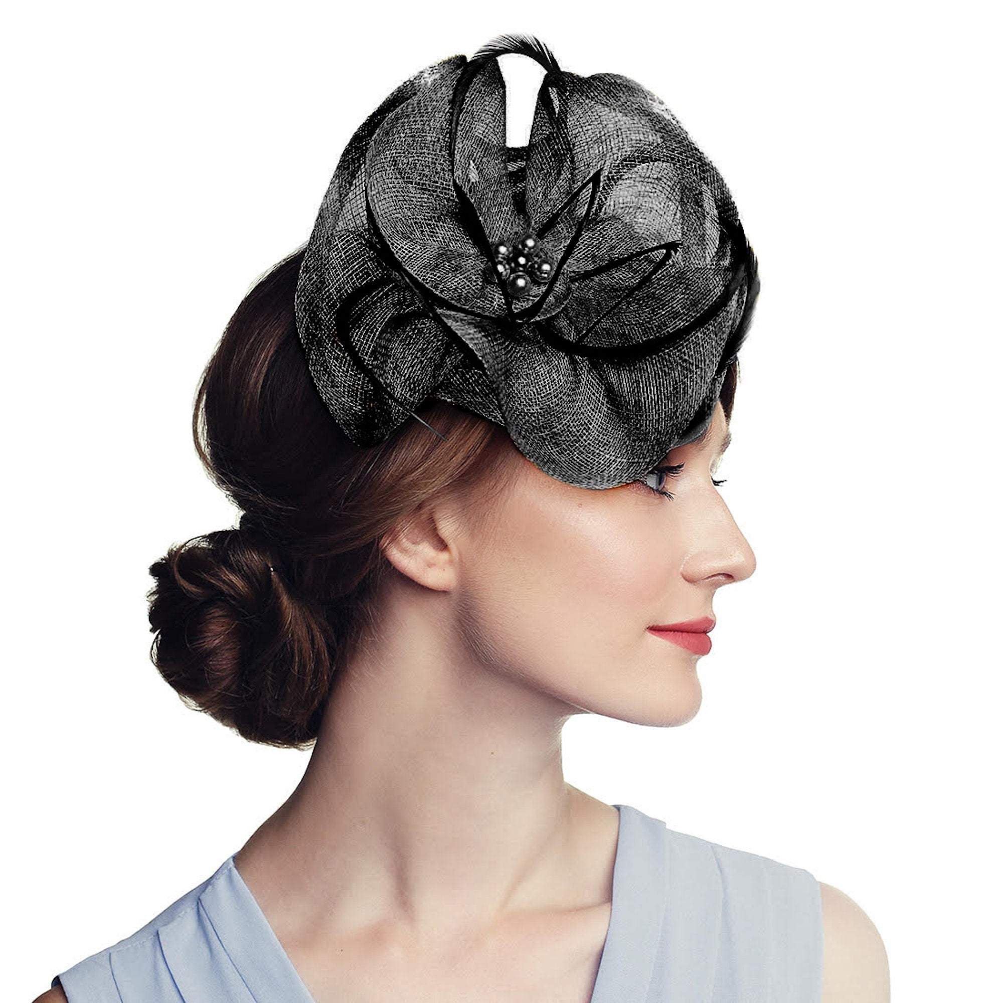 Black floral-shaped hat with a pearl and rhinestone embellishment. The hat is made of a woven material and has a layered design.
