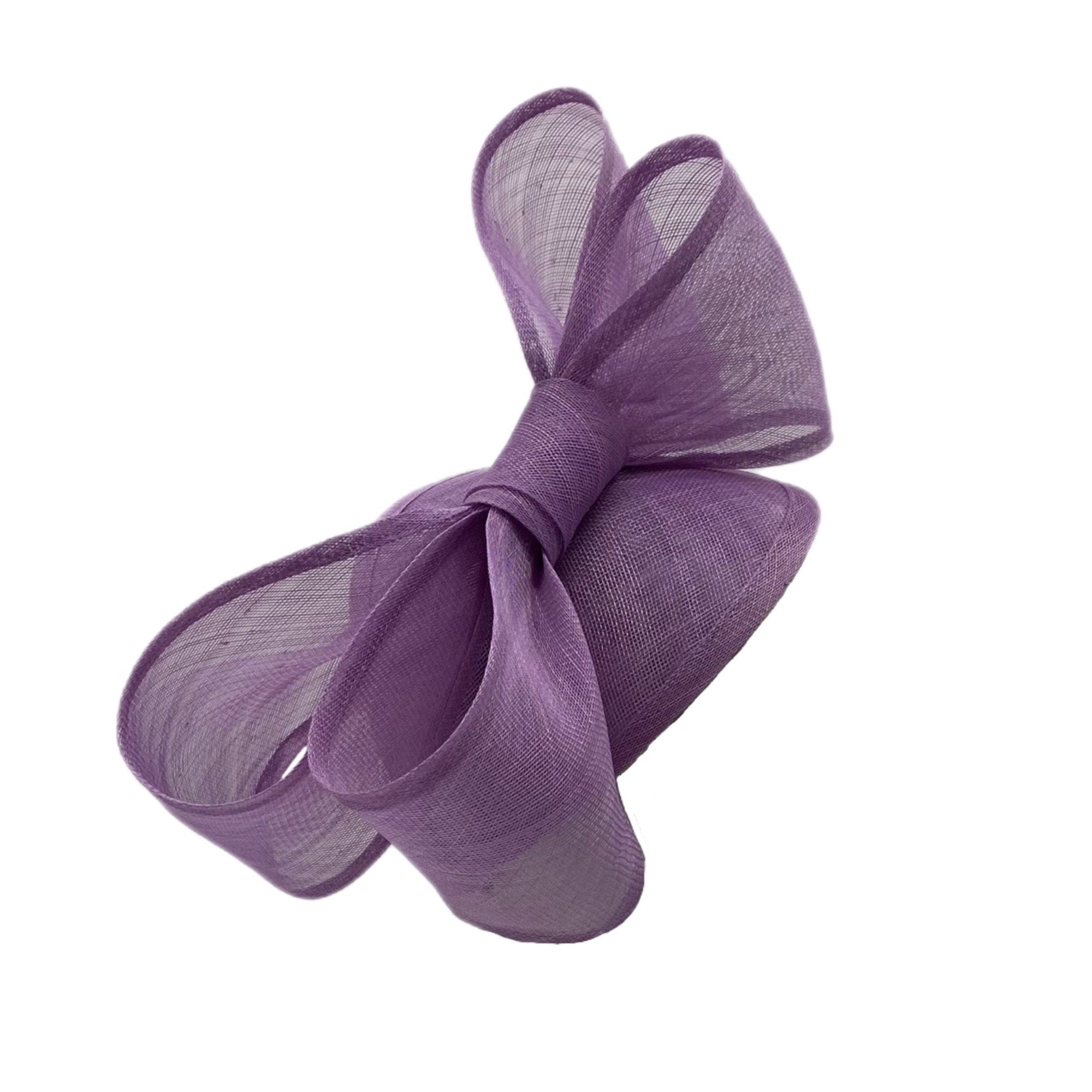 A lavender fascinator hat with a large bow.