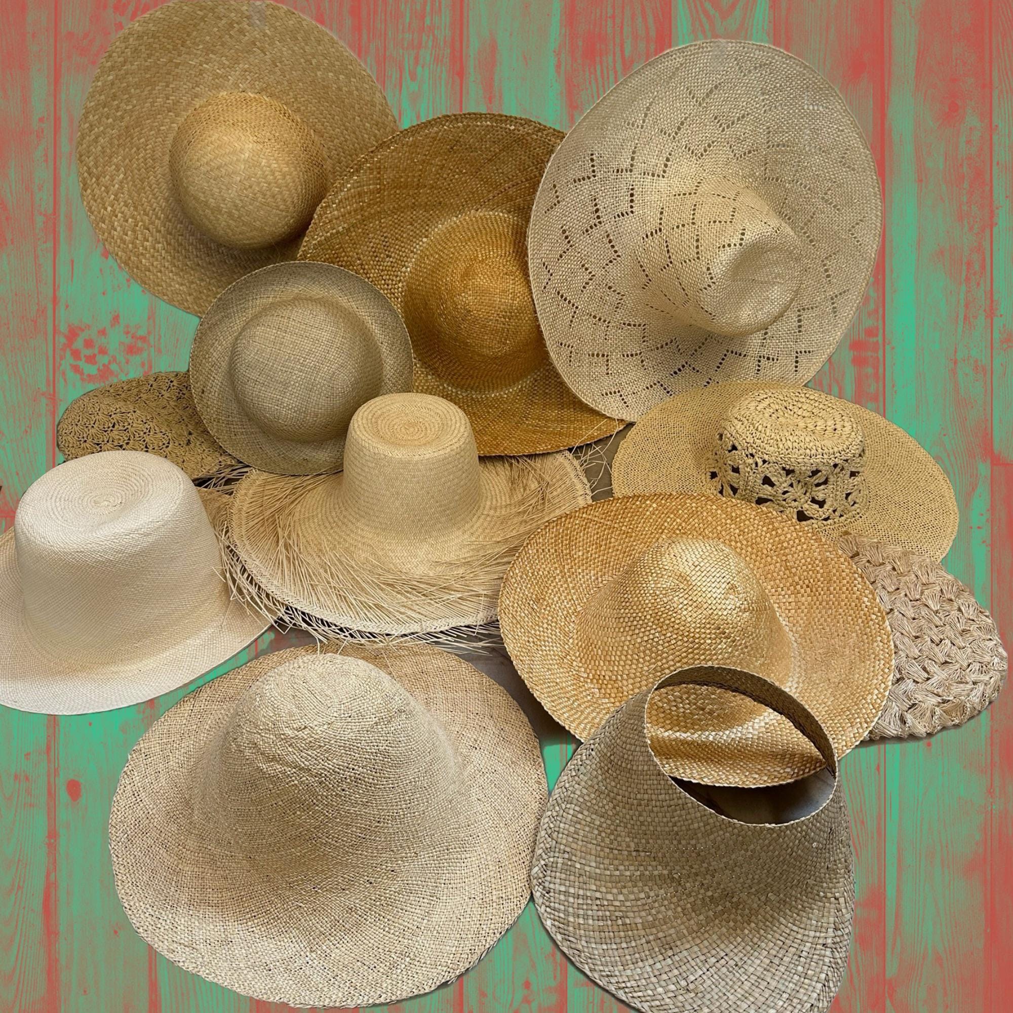 Collection of woven straw hats in various styles and sizes. The hats are in shades of beige and tan, with wide brims and varying crown heights.